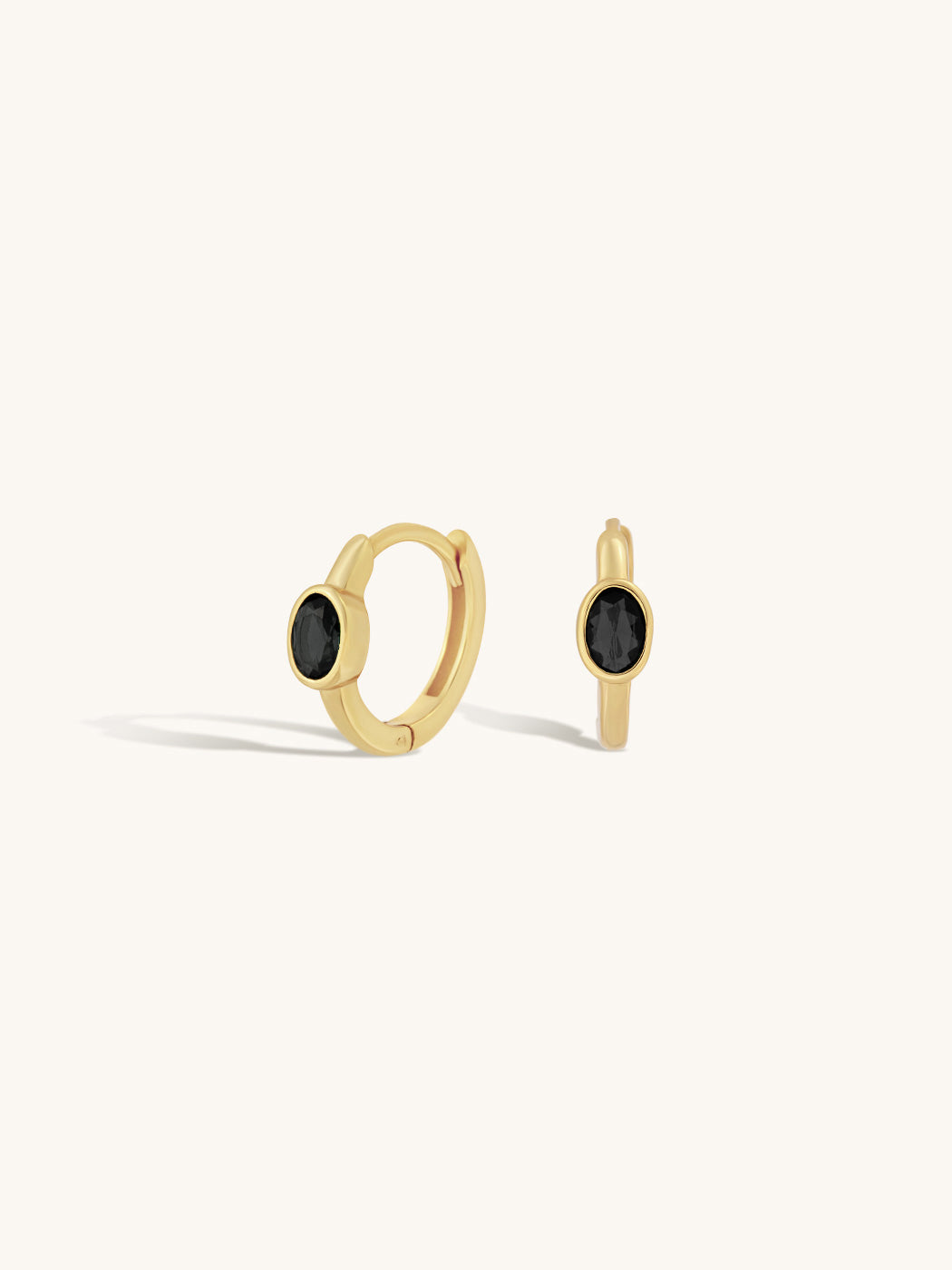 black agate oval gemstone on small gold huggie