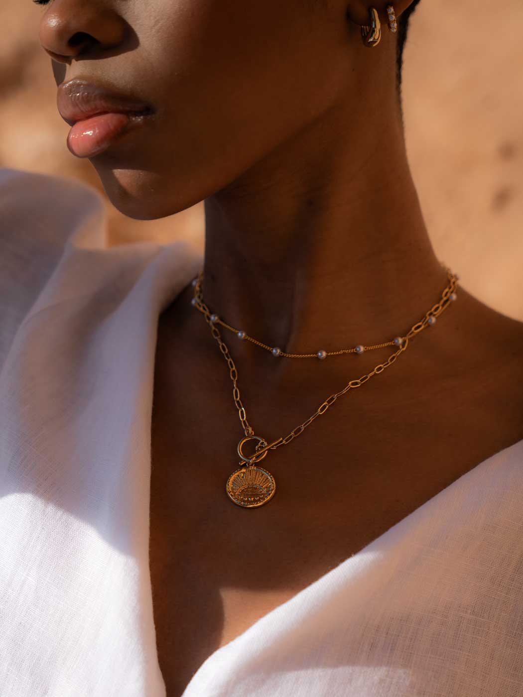 gold sun talisman necklace
