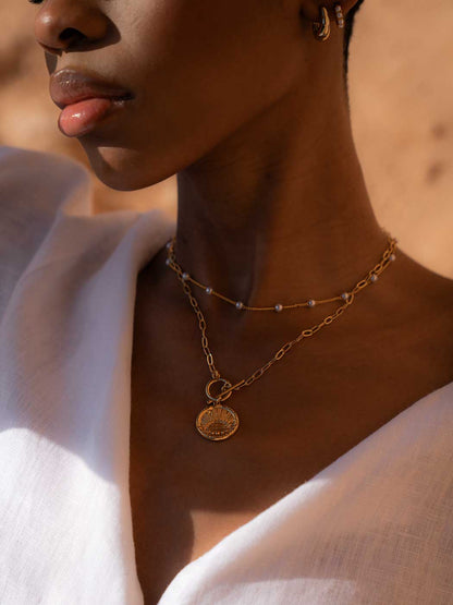 gold sun talisman necklace