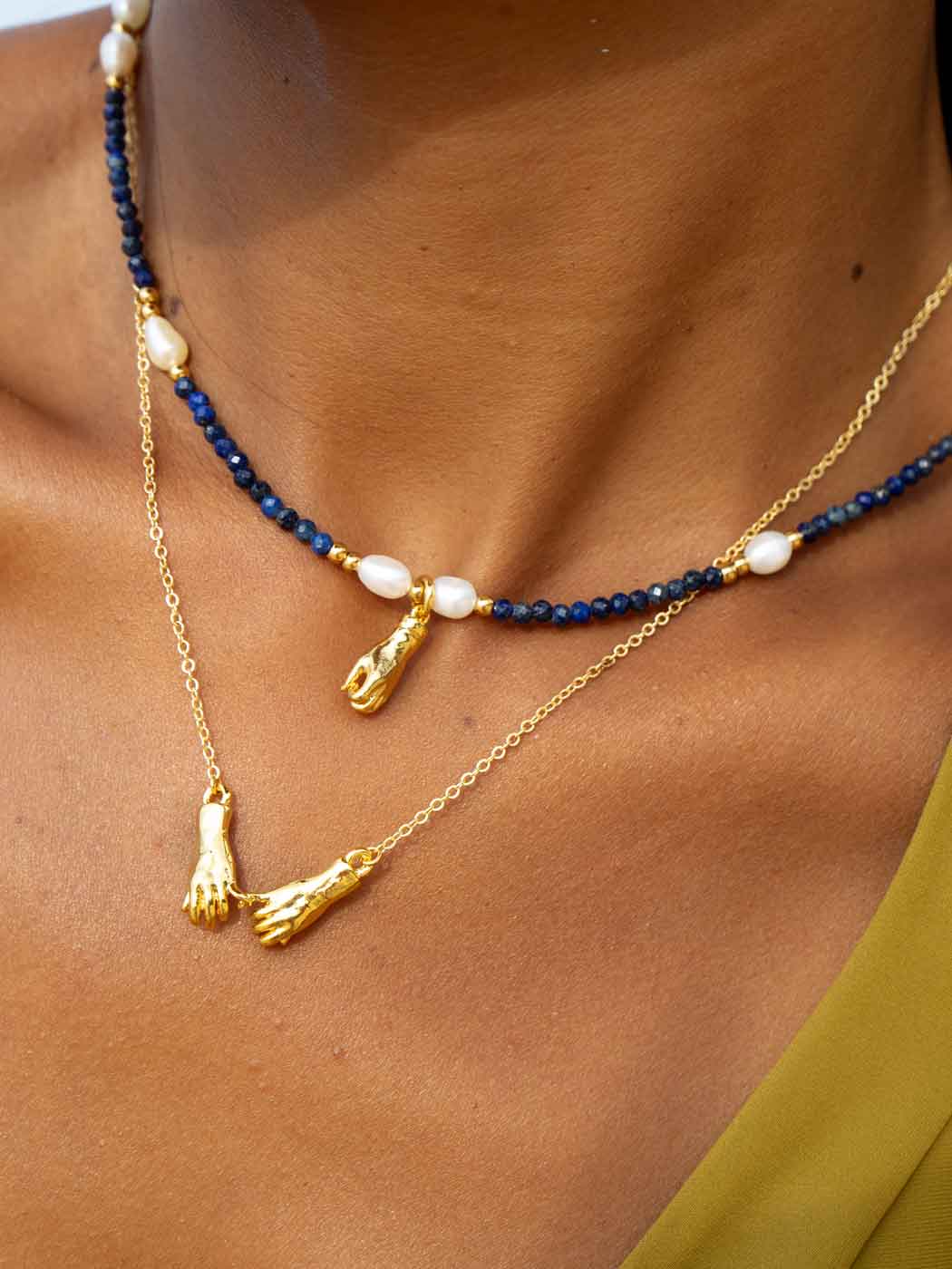 joined-hands-symbolic-necklace-close