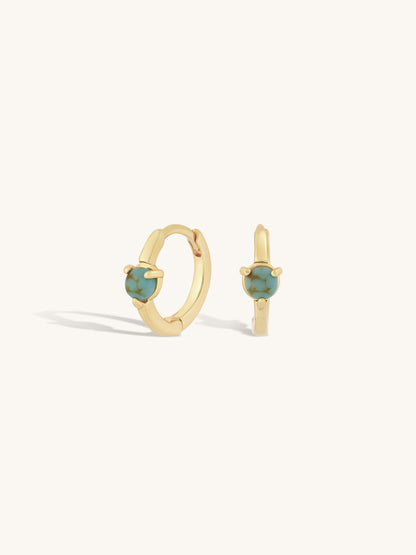 single round turquoise stone set on simple gold huggie