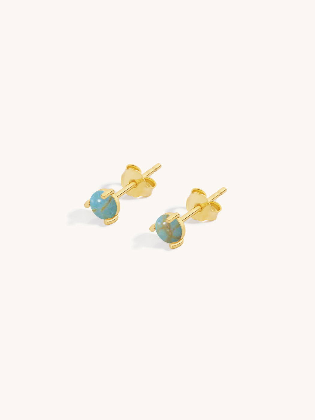 rounded polished turquoise stone studs encased in gold
