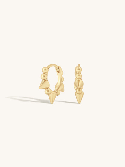 minimal and edgy gold pointed huggies on white background