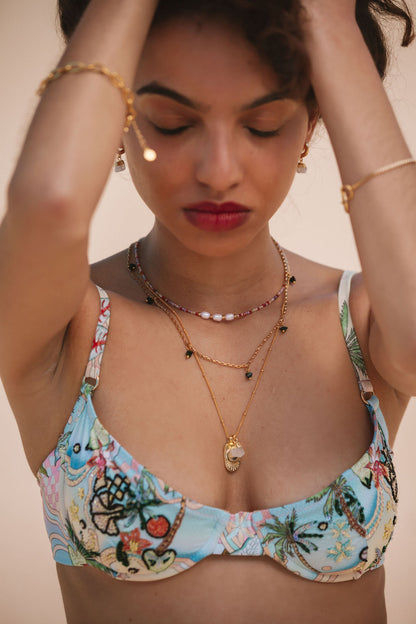     layered necklace stack with celetial theme