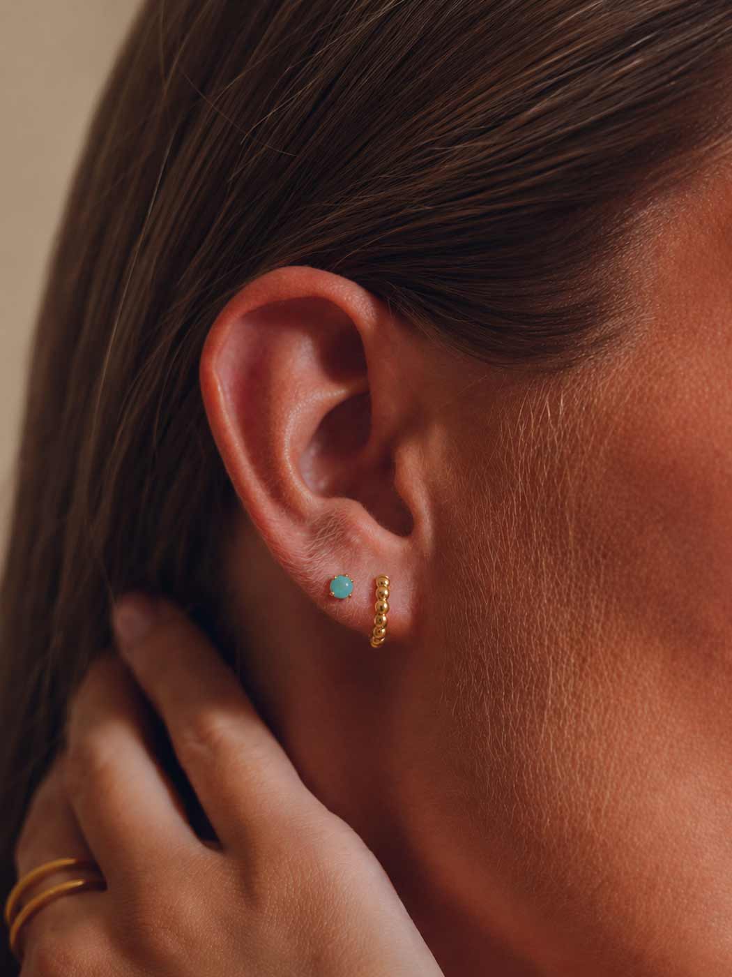 rounded turquoise stud in second piercing