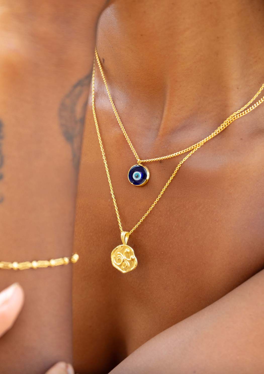 starsign necklace on body close up