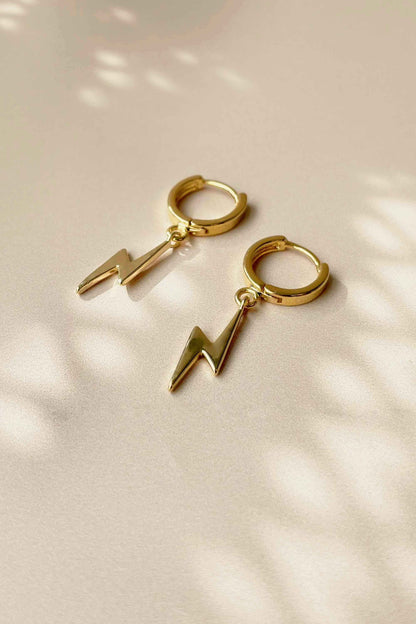 GOLD-LIGHTNING-HUGGIES-HOOPS-FLAT-LAY