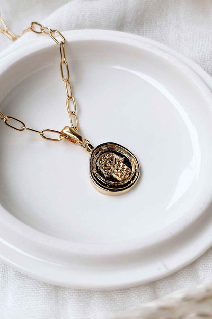 Hamsa-Hand-Talisman-Spiritual-Pendant-Necklace-on-dish