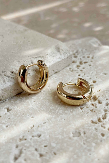MINI-CHUBBY-GOLD-INFINITY-HOOP-EARRINGS-FLAT-LAY-CLOSE-ANGLE