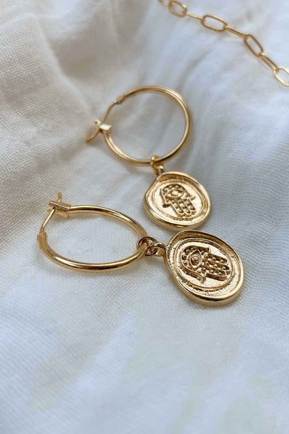 gold-hoops-hamsa-hand-statement-earrings-flat-lay