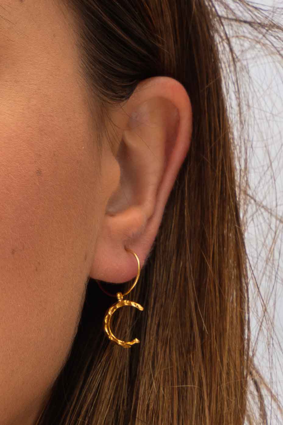 hammered-gold-textured-moon-pendant-gold-hoops-close-up