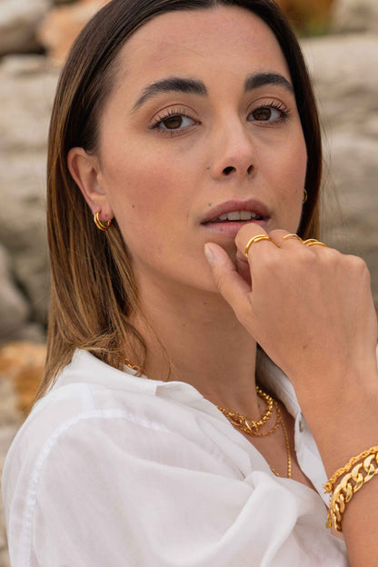 tri-prong-classic-retro-gold-hoop-earring-on-body.